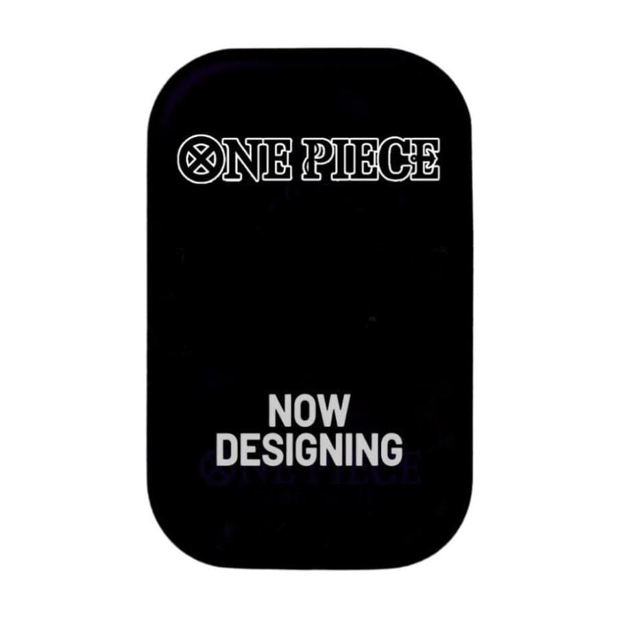 A black mini-tin box with the 'One Piece' anime series logo and text 'NOW DESIGNING' on the front.
